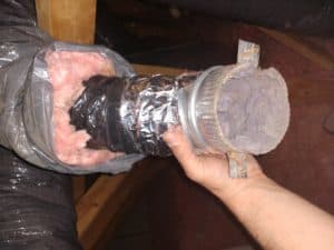 Picture of plastic HVAC ducting used for dryer venting in an attic. this is a code violation and was from a dryer vent repair job in Charles Town, WV.
