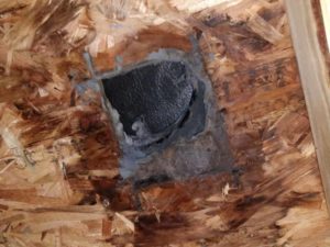 Picture of a dryer vent roof penetration in Thurmont, MD cut too small