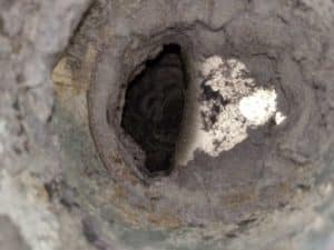 Picture of a dryer vent roof penetration in Frederick, MD that is blocked by the vent cover