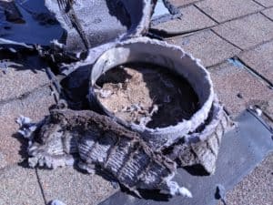 Picture of a dryer vent louver screened roof cover improperly positioned and blocking the vent in Frederick, MD